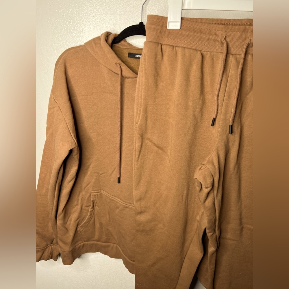This is a males Brown Jumpsuit from FNM Collection in a size large